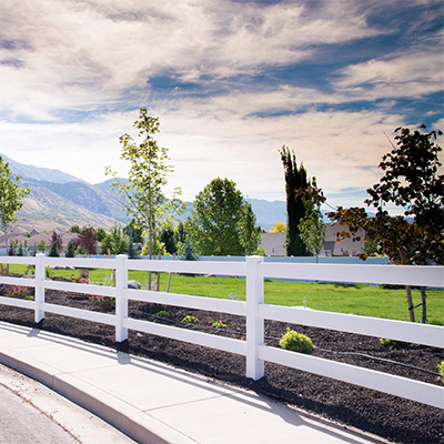 White three-rail ranch rail fence, one of our many choices for wholesale vinyl fencing near Simi Valley.