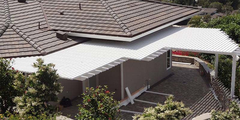 Vinyl patio cover near Helm connected directly to a house.