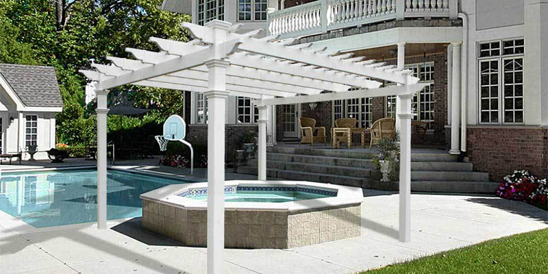 White San Joaquin vinyl patio cover placed over an outdoor spa.