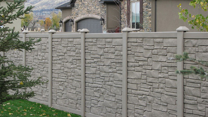 Ecostone SimTek Composite Fencing surrounding a house, an example of our Duarte homeowners association fences.
