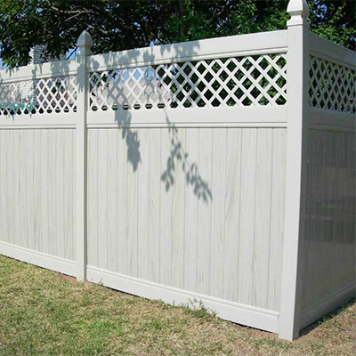 Privacy fencing with lattice top from our Arvin vinyl fence & gate supply.