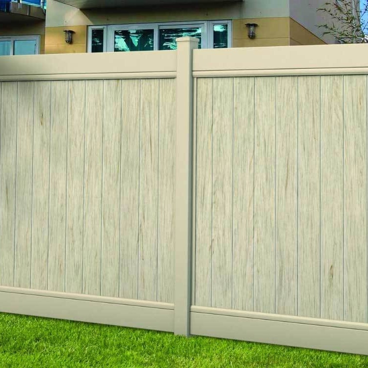 A tan solid privacy vinyl fence near West Covina, California, with vertical textured panels.