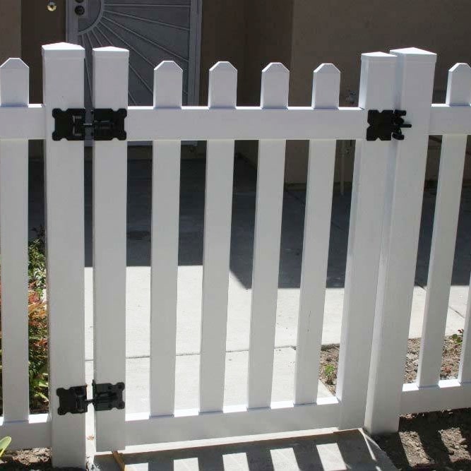 A white picket custom vinyl gate near Simi Valley, California, in front of a residence.