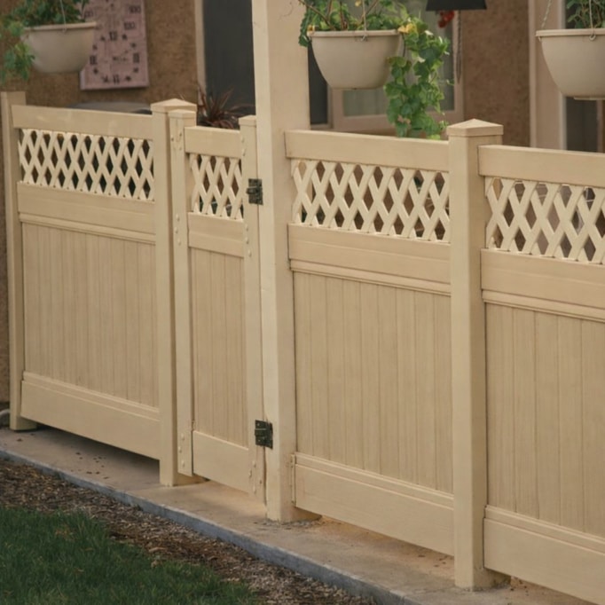 A tan gate and large reveal lattice Modesto vinyl semi-privacy fencing.