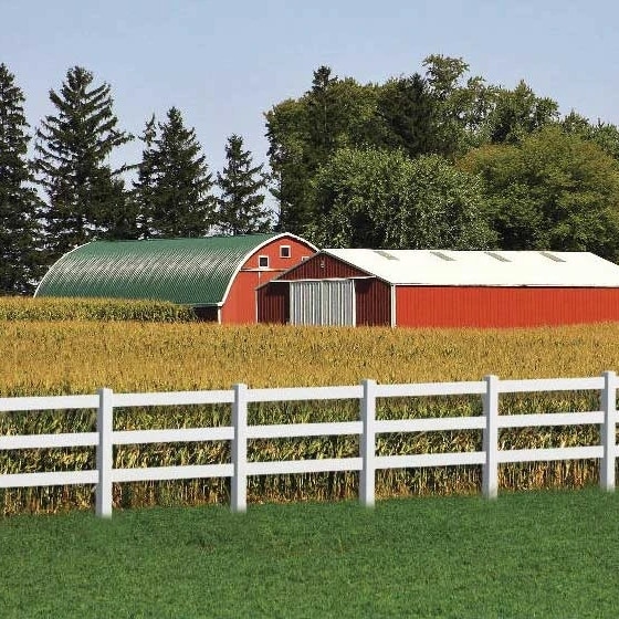 Santa Clarita vinyl agricultural fencing in front of farm buildings surrounded by a crop.